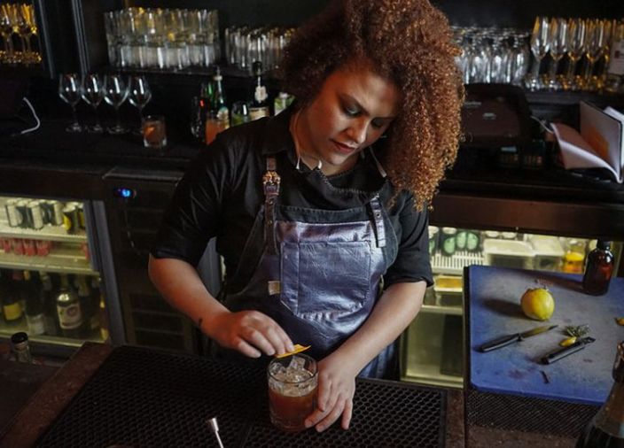 Sabrina Traubner making a whiskey cocktail 