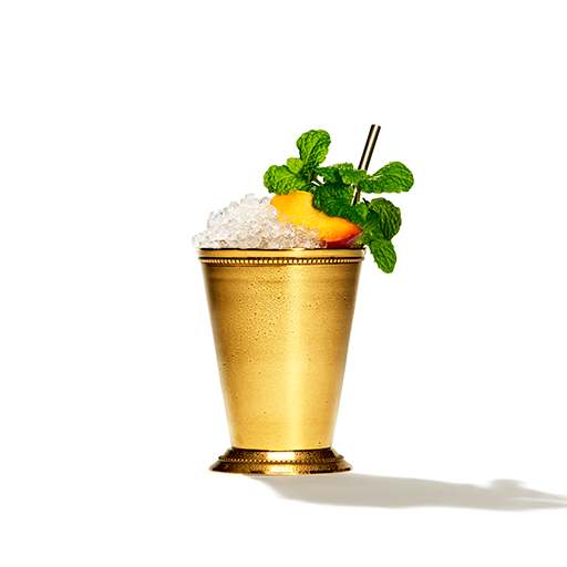 Julep cocktail in a copper mug with mint garnish 