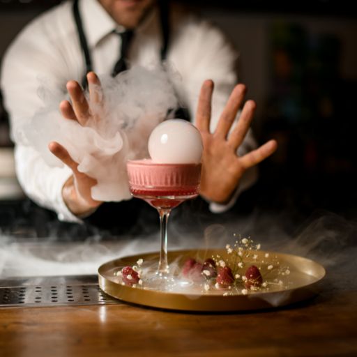 Bartender creating unique cocktail with steam bauble on top