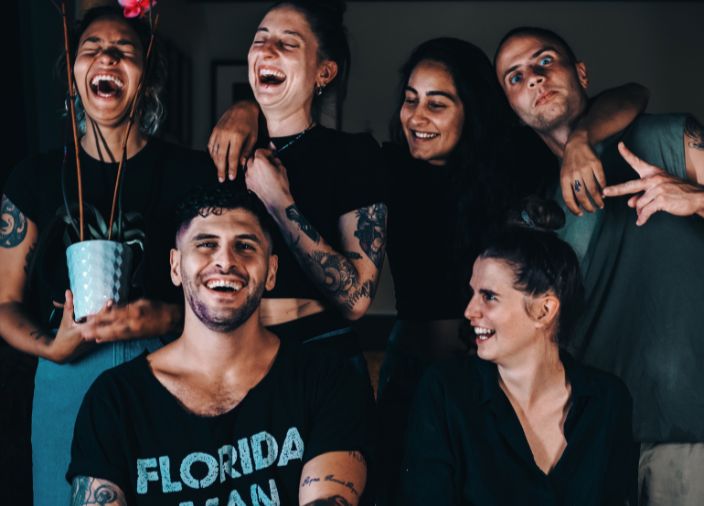 Six smiling bartenders