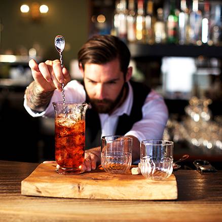 Bartender stirring a cocktail