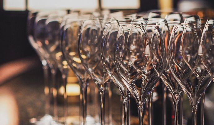 A collection of wine glasses on a counter top 