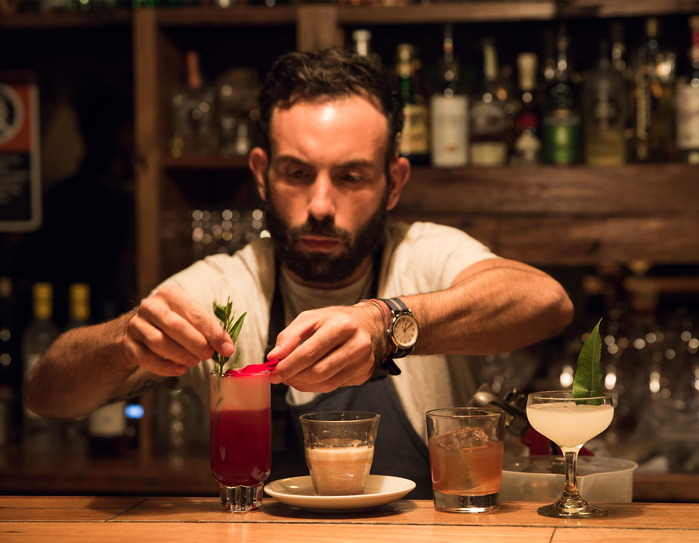 Tim Philips garnishing cocktails at the bar