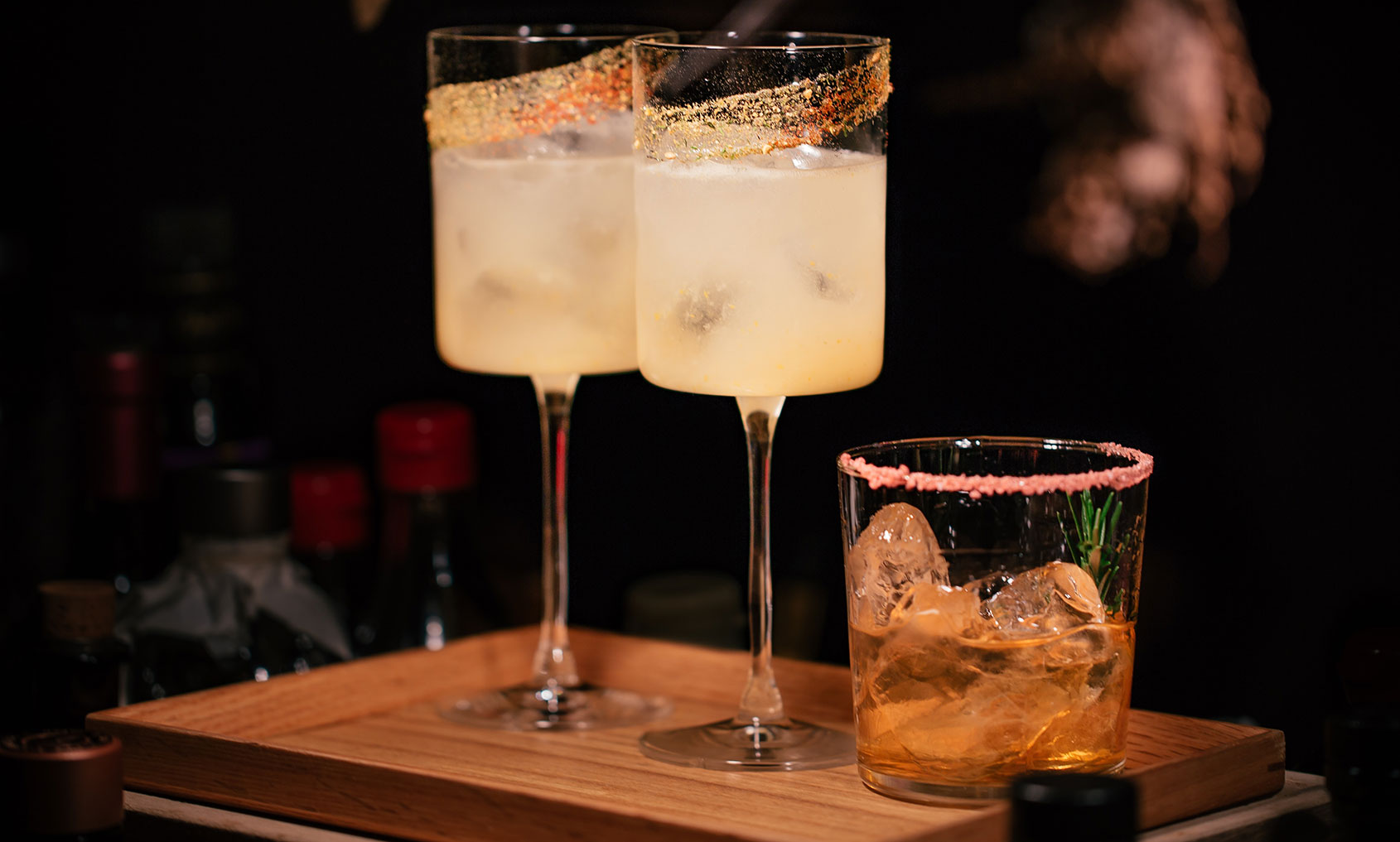 Three cocktails waiting to be served