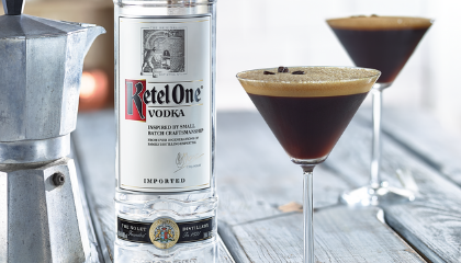 Ketel One Espresso Martini in an Espresso Glass with bottle of Ketel One Vodka 