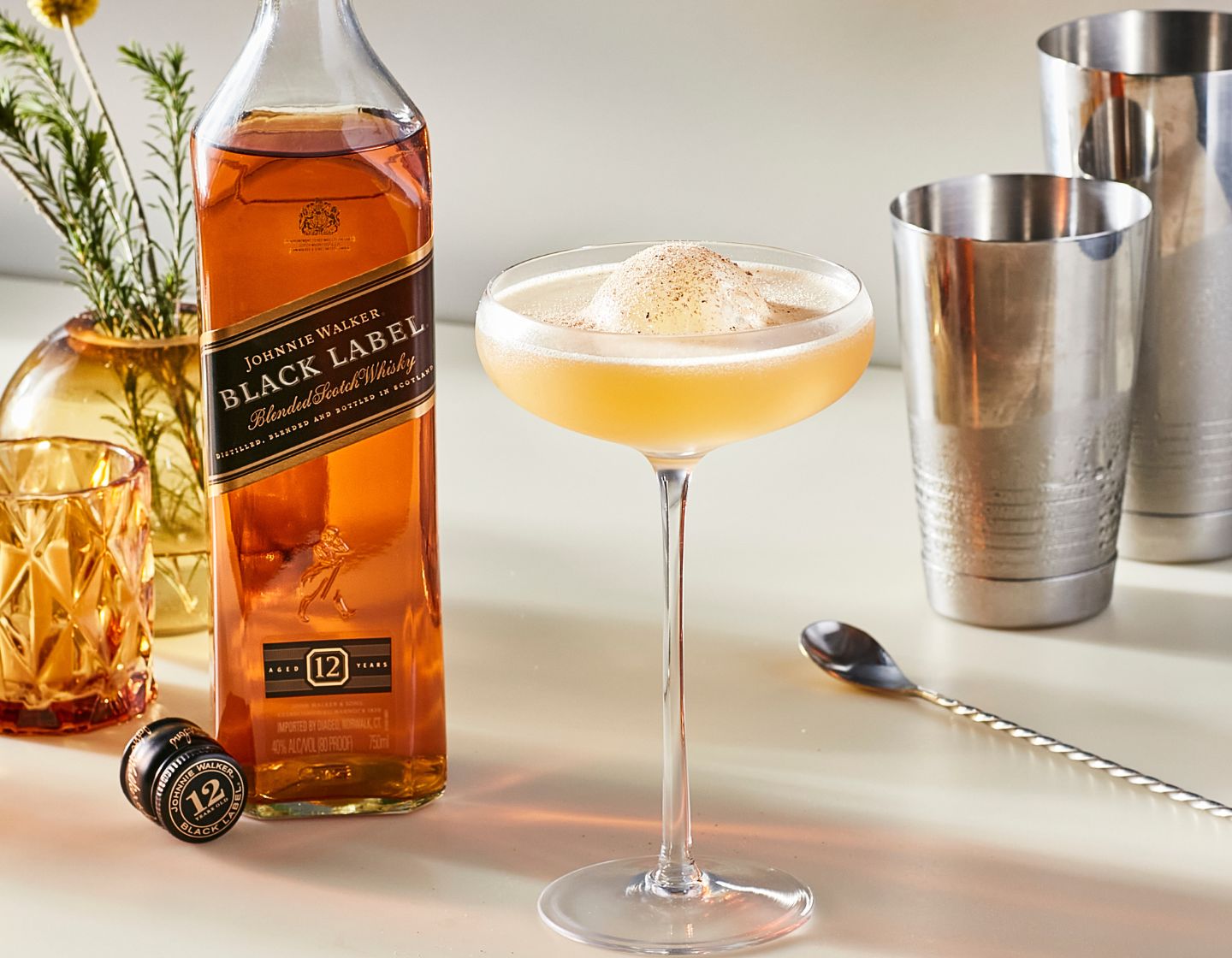 Johnnie Walker Black Label bottle with two cocktails  