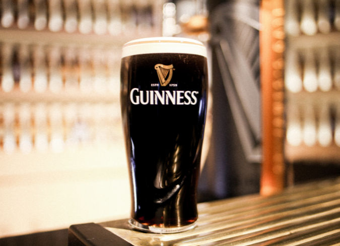 Pint of Guinness on table in the foreground