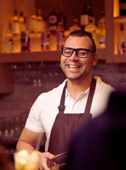 Bartender stood smiling
