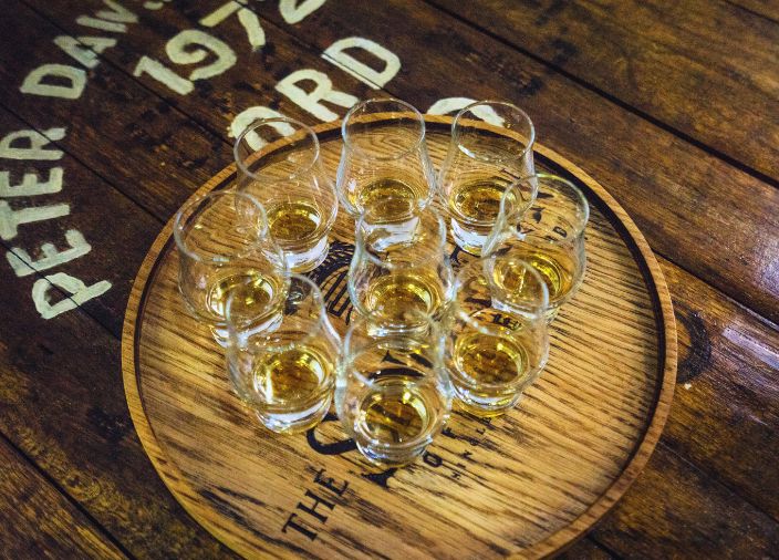 9 glasses of whisky on a cask.