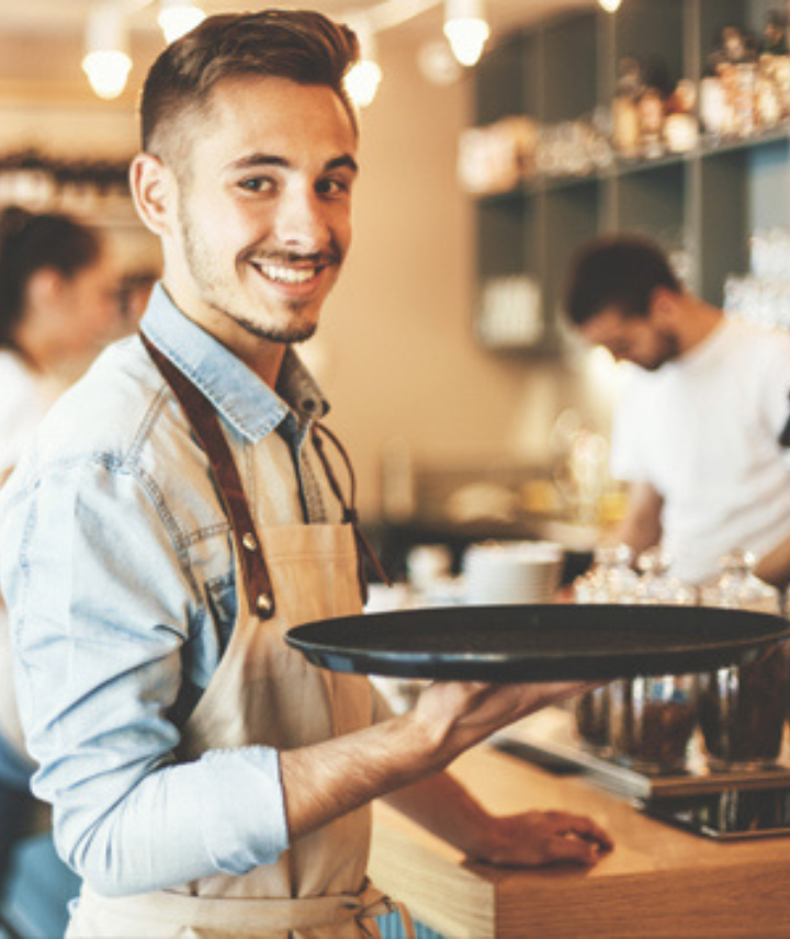 Bartender with tray smiling