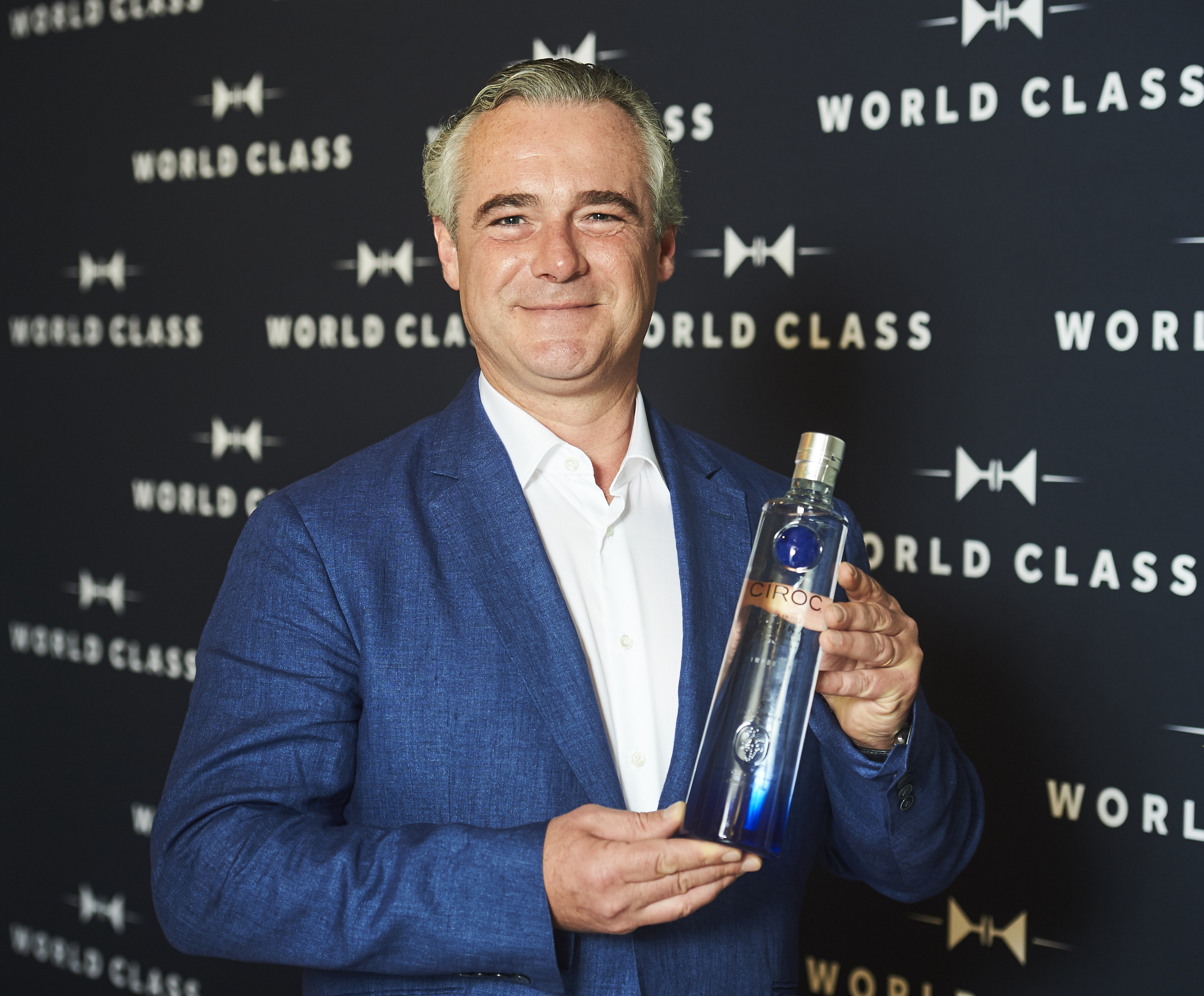 Jean-Sebastien Robicquet holding a bottle of Ciroc Vodka
