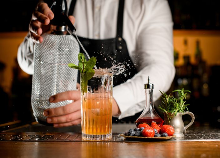 Bartender creating a cocktail, carbonising it