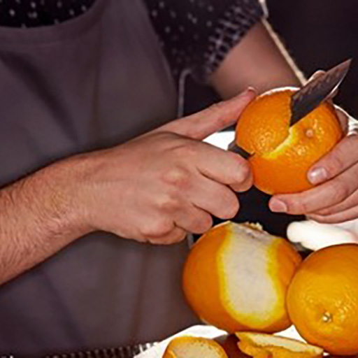 Bartender Cutting Orange Peel for Garnish