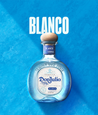 Bottle of Don Julio Blanco against blue background