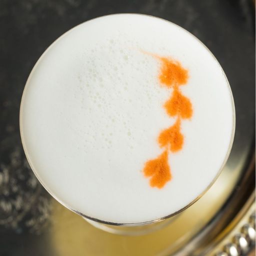 Foam cocktail with orange pattern.