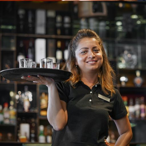  Bartender smiling with a tray 