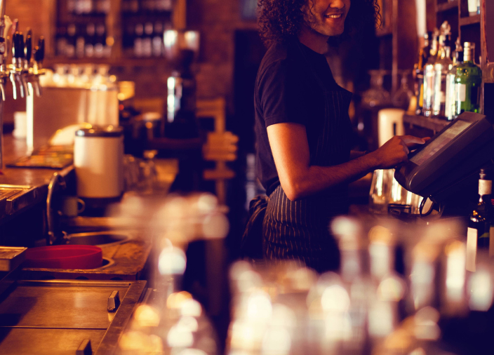 Bar staff professional at a POS unit