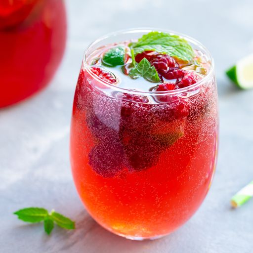 Carbonated red cocktail with berries 