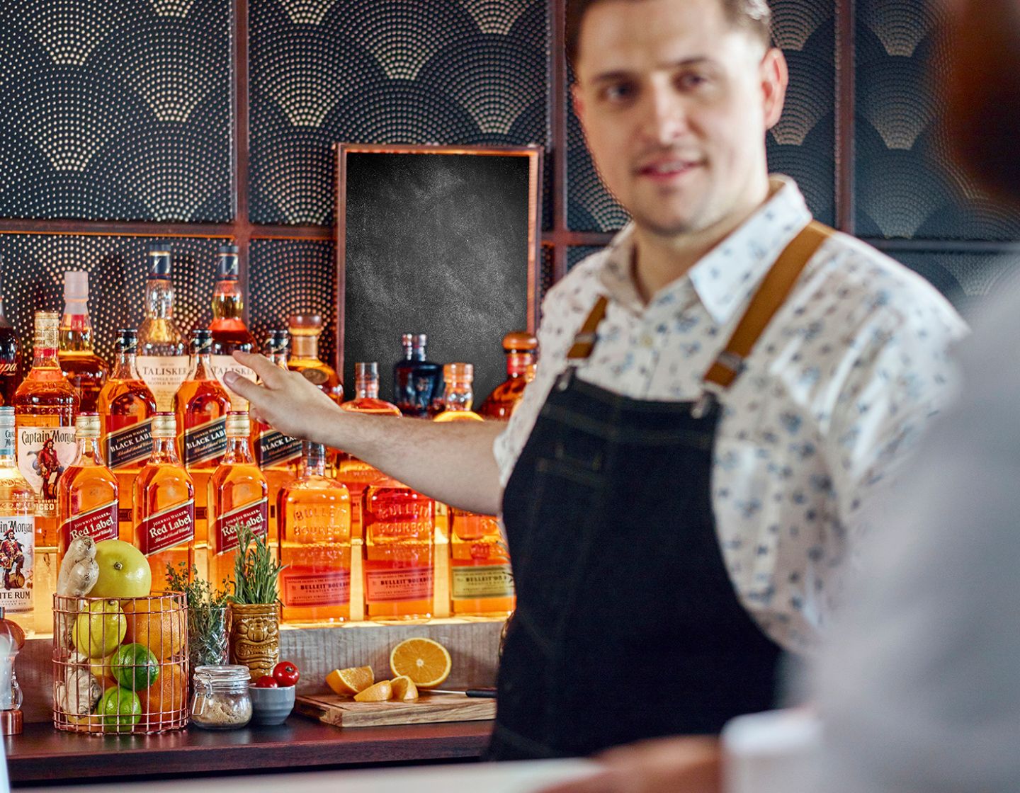 Bartender showing back bar close up