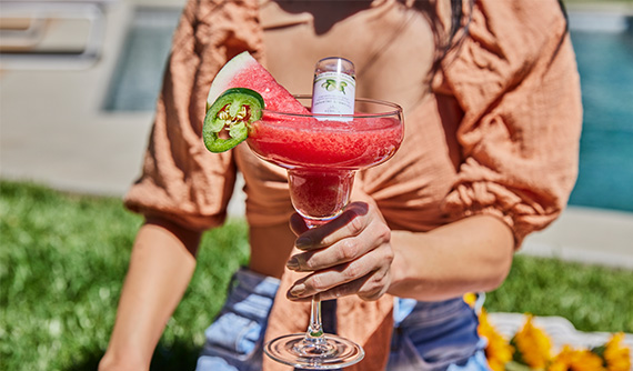 Woman holding a frozen cocktail