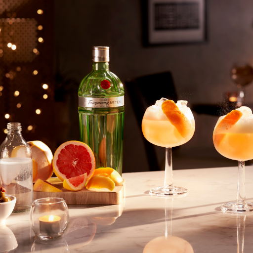 Tanqueray Gin Cocktails with Bottle of Tanqueray Gin in a seasonal Christmas Setting 