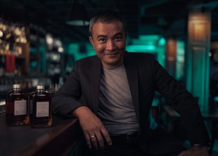 Yangdup Lama sitting in a bar