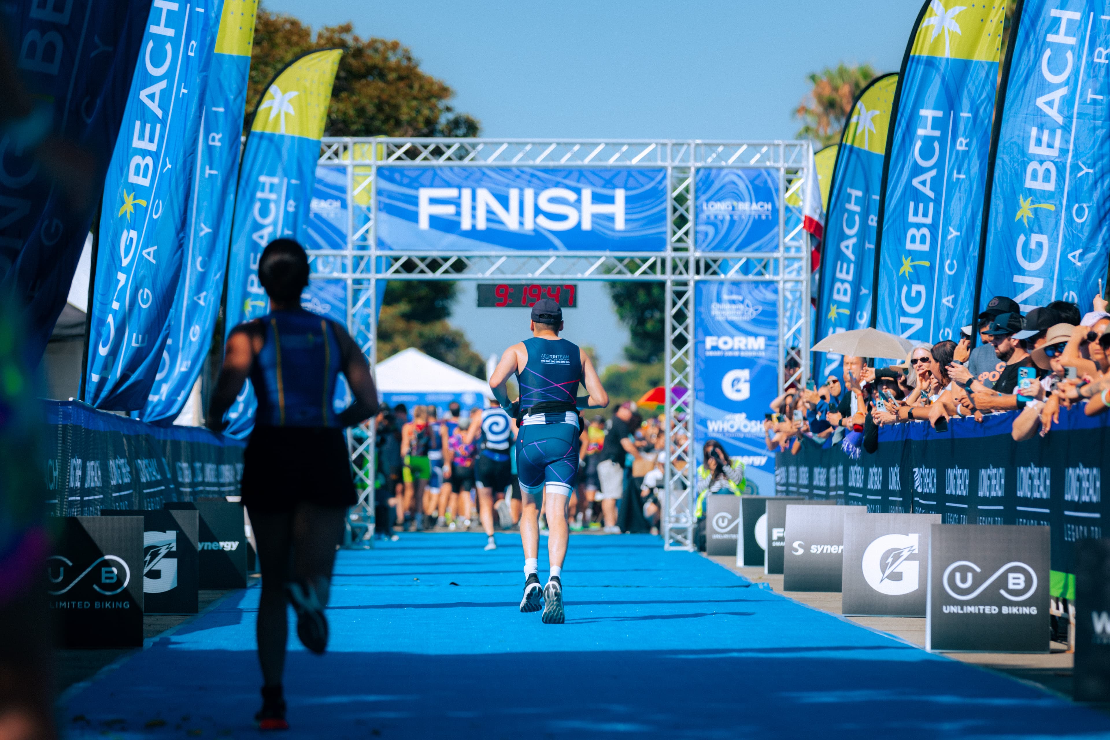 A man finishing the Long Beach Triathlon