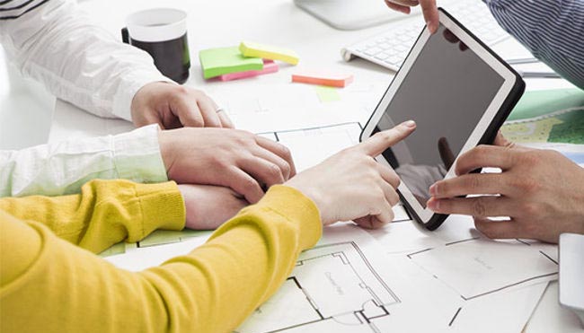 detail of architectural plans and a tablet