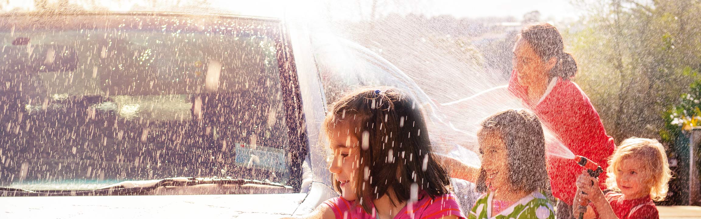 Children cleaning a car