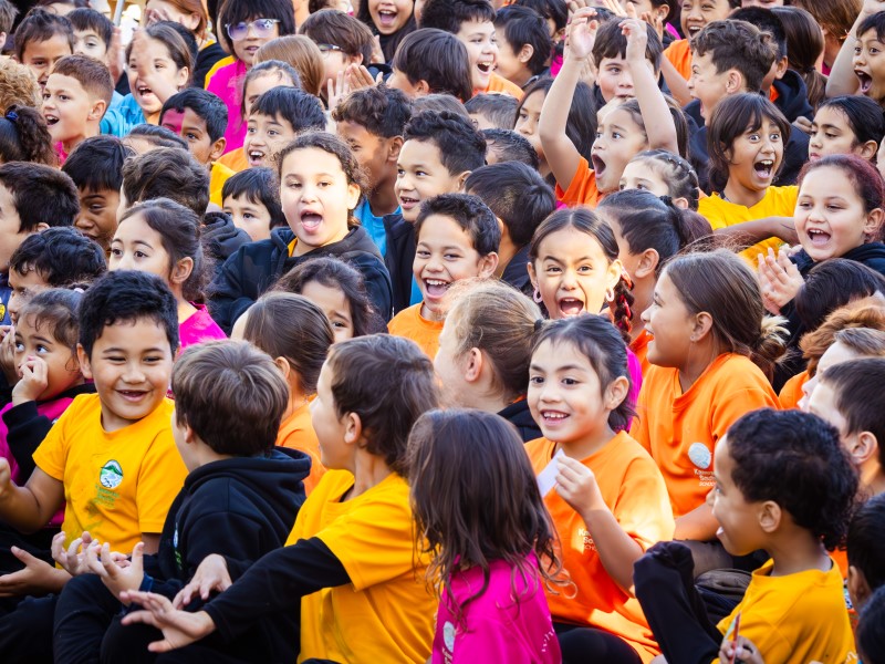 Smiling children at Kawerau South School assembly