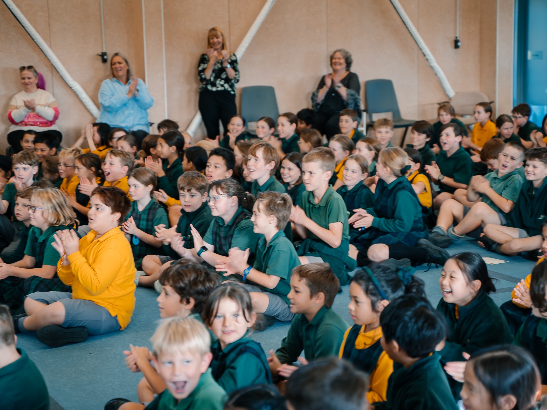 Students finding out they had won the Big Little Sponsorship during assembly.