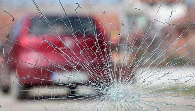 cracked windscreen looking onto another car
