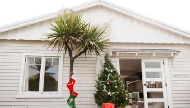 12 days of christmas safety. House with christmas tree out front.