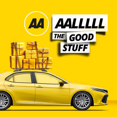 Wrapped gifts on top of yellow car.