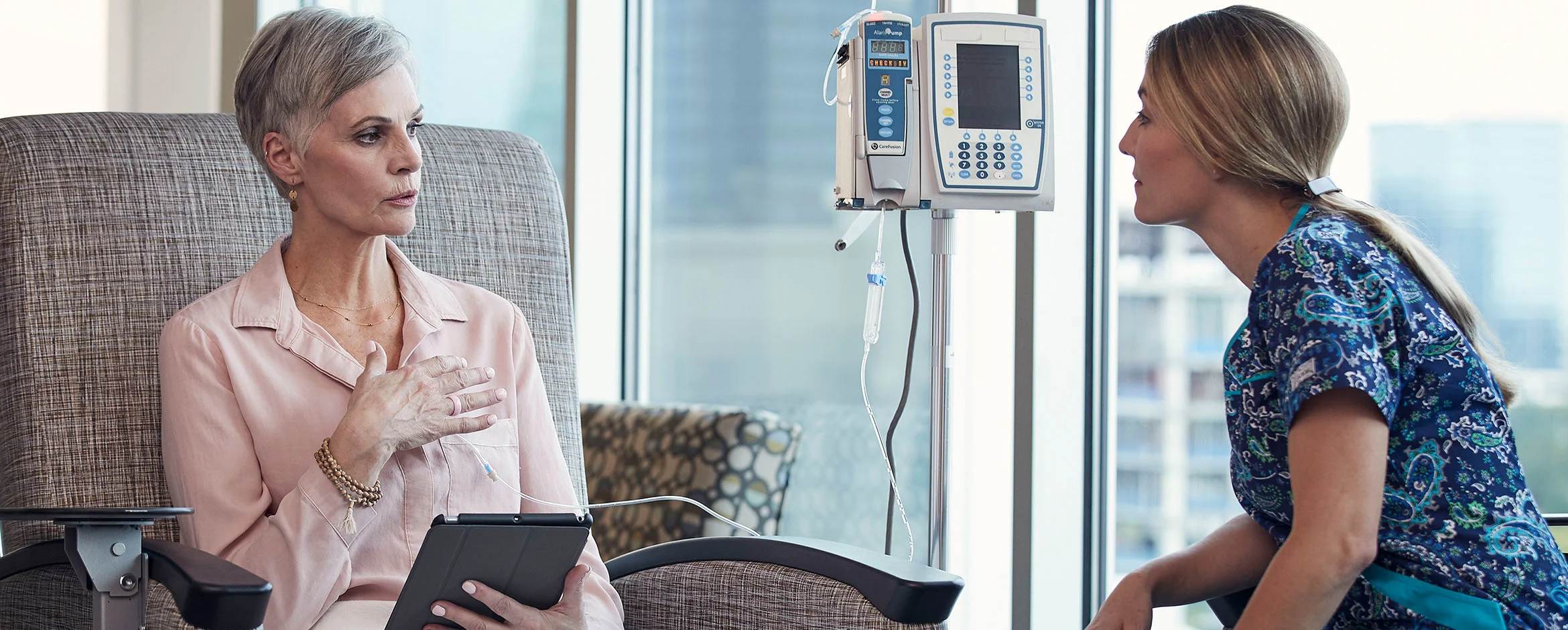 A female patient discusses therapy with her healthcare provider
