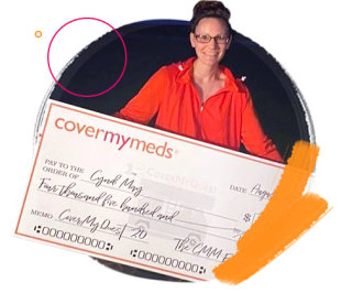 Cyndi poses with her quest grant check.
