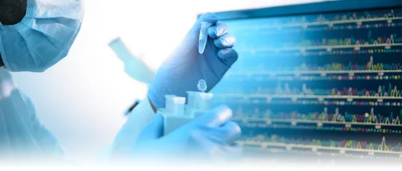 Lab technician pulls vial from test tube.