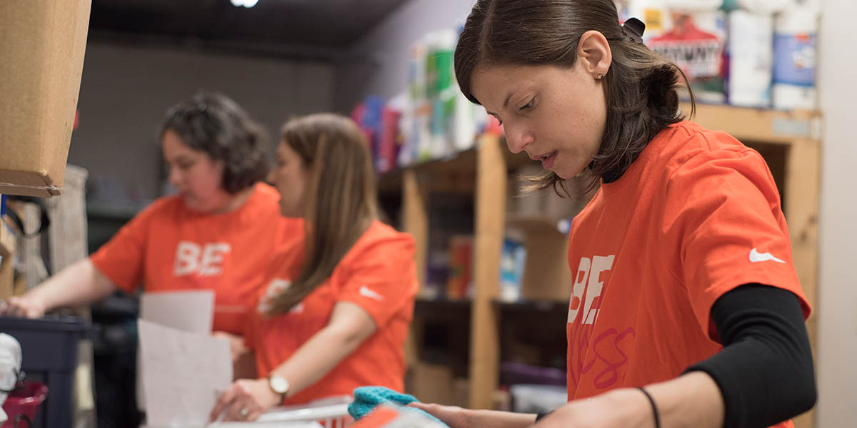 A group of CoverMyMeds employees in a candid photo volunteering.