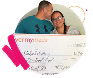 A photo of rachel and her husband with her quest grant check.