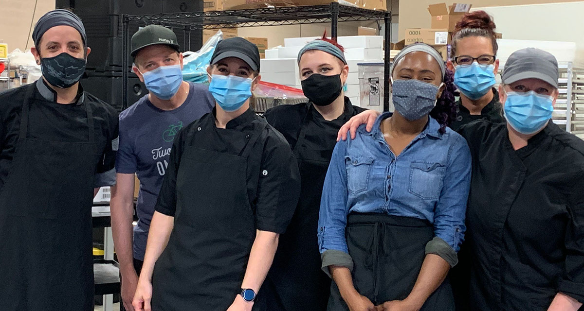 The CoverMyMeds culinary team poses for a group photo while volunteering at Service!