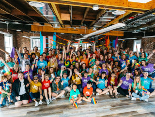 A group of CoverMyMeds employees gather to celebrate Pride Month in June 2019.