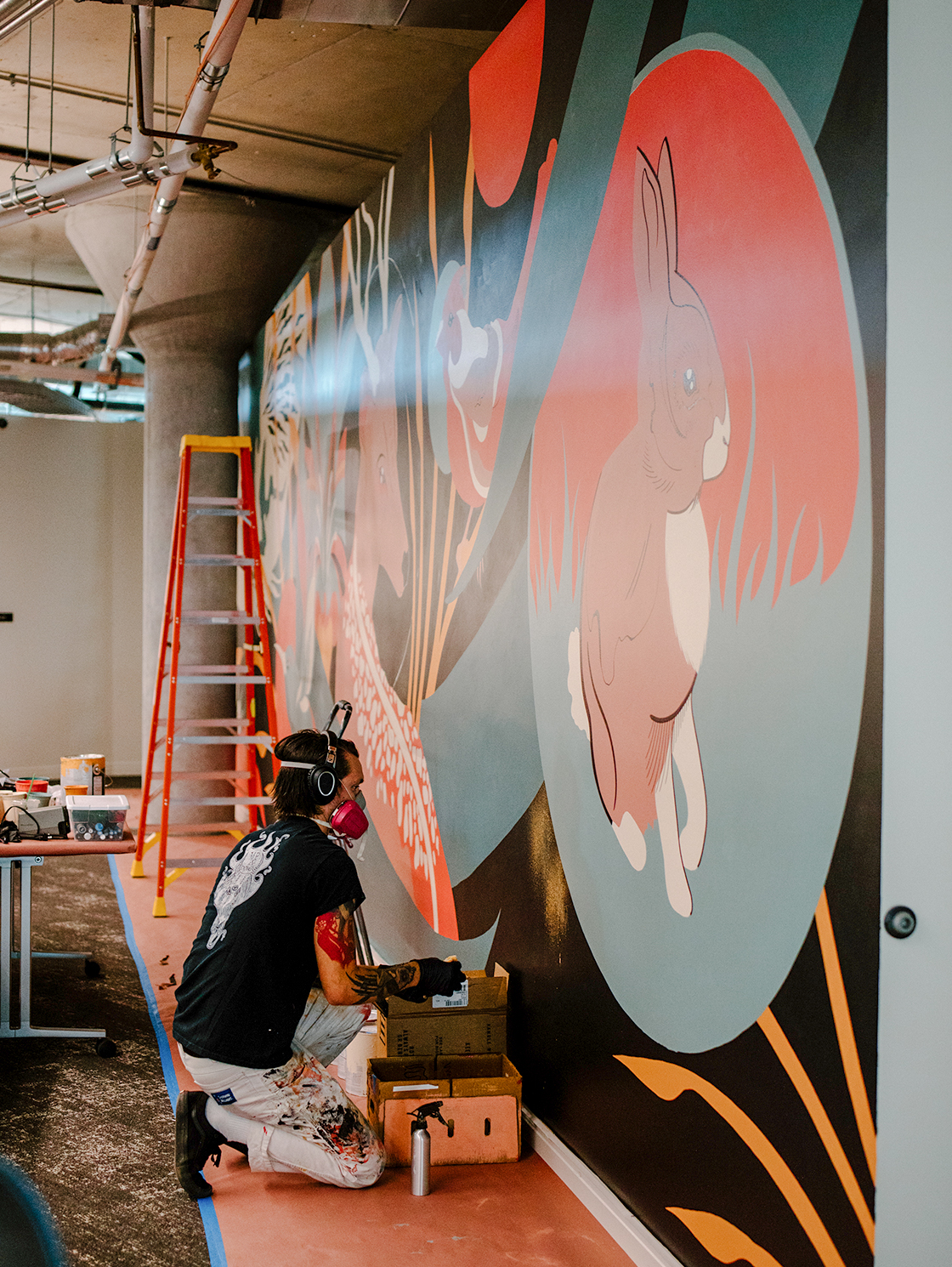 A mural being painted inside the CoverMyMeds campus. 