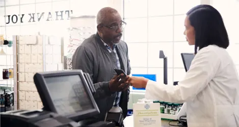 Patient shows pharmacist details on their smartphone.