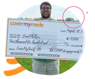 A photo of Brad with his check.