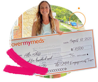 Allie poses for a picture with her quest grant check.