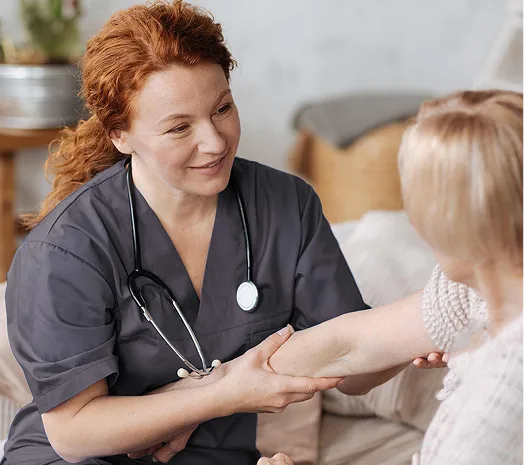 A female nurse checking a patient's arm