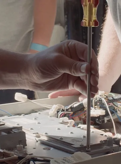 A technician working on an electrical box
