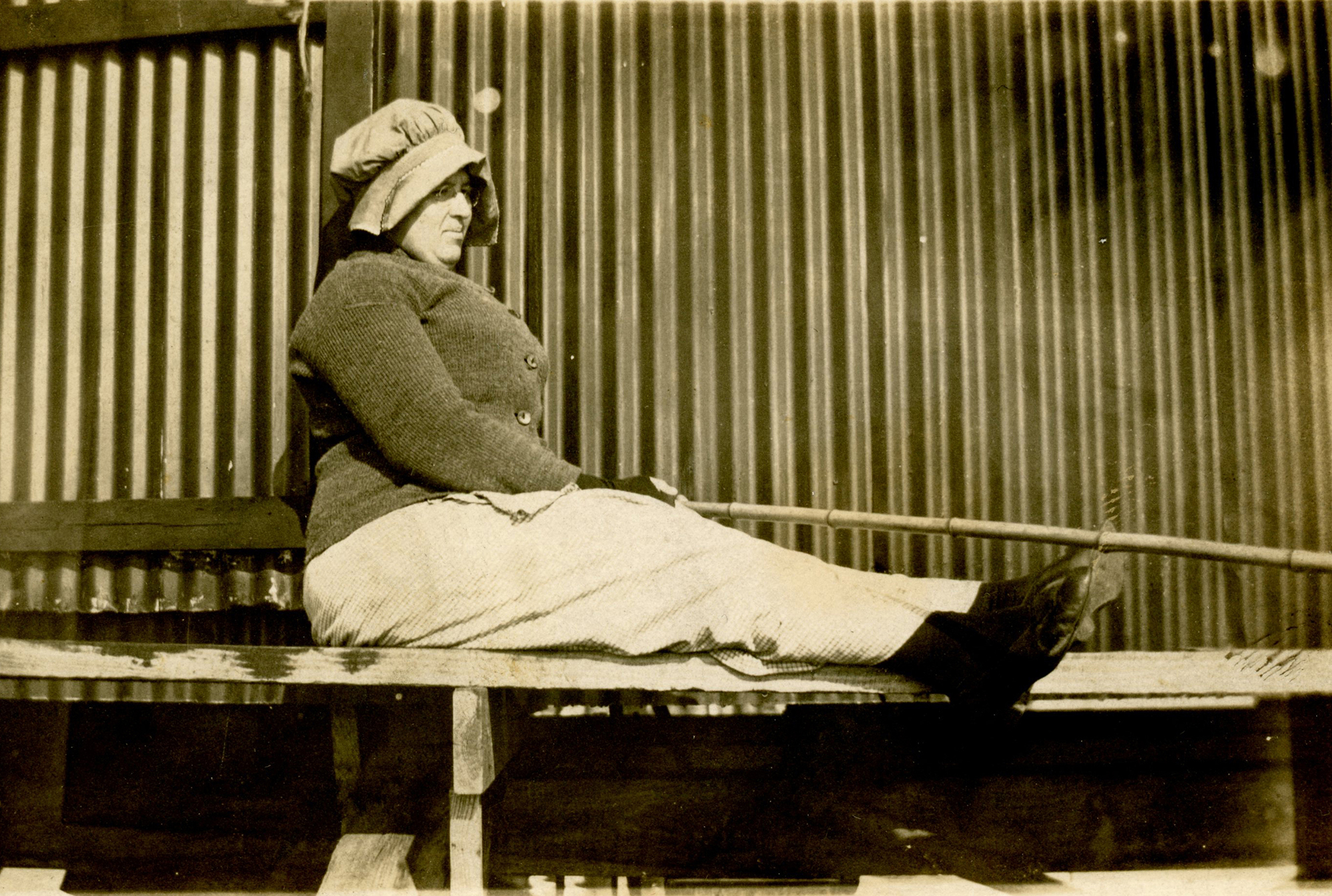 Real photo postcard, woman fishing off pier, ca. 1915
