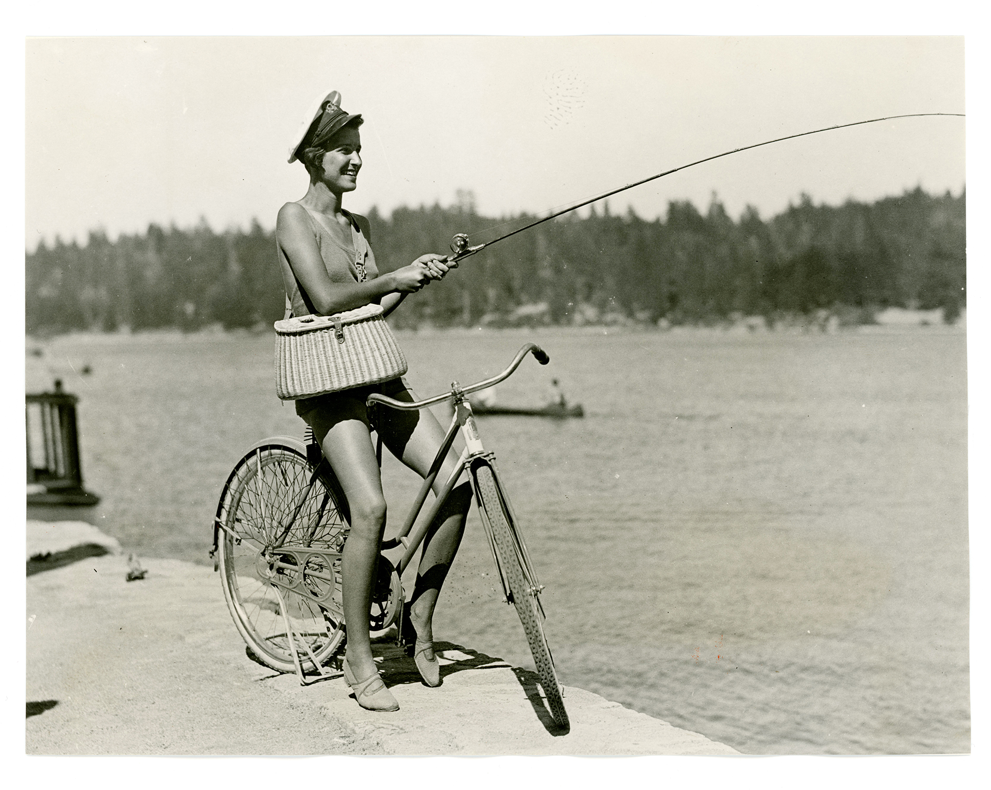 Fishing on a bicycle, Lake Arrowhead, California, 1933