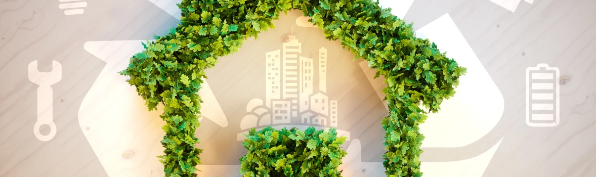 Nachhaltiges Bauen symbolisiert durch grünes Haus, Recycling und Energiesymbole